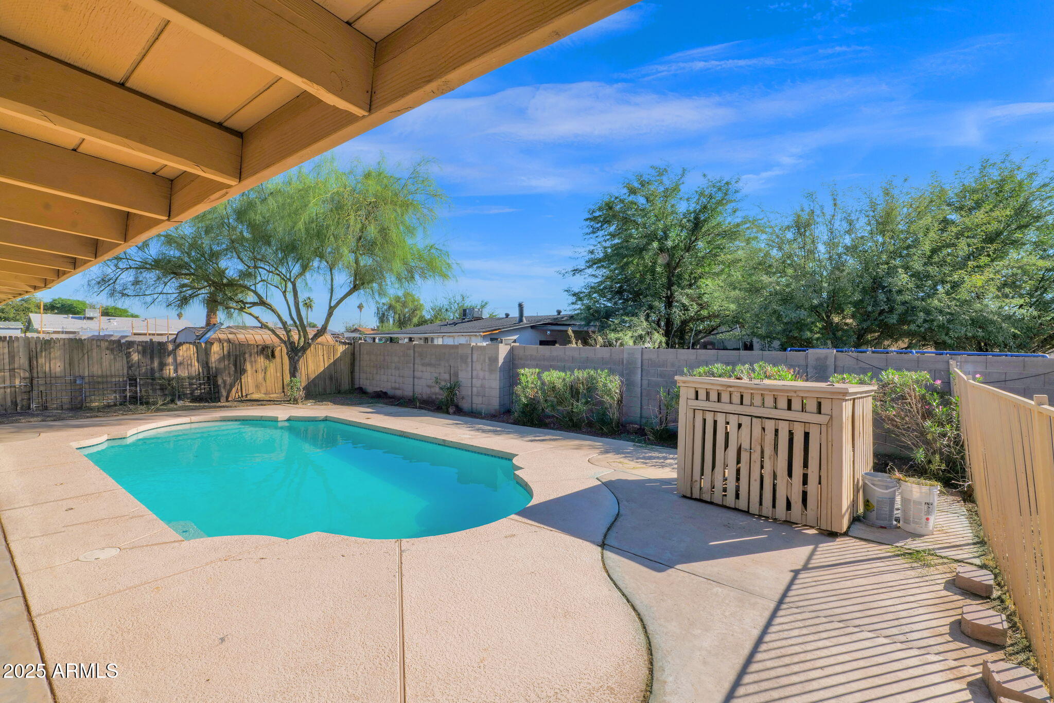 7221 Virginia Avenue Phoenix, AZ 85035 - Photo 29 of 33 a view of a swimming pool with a patio