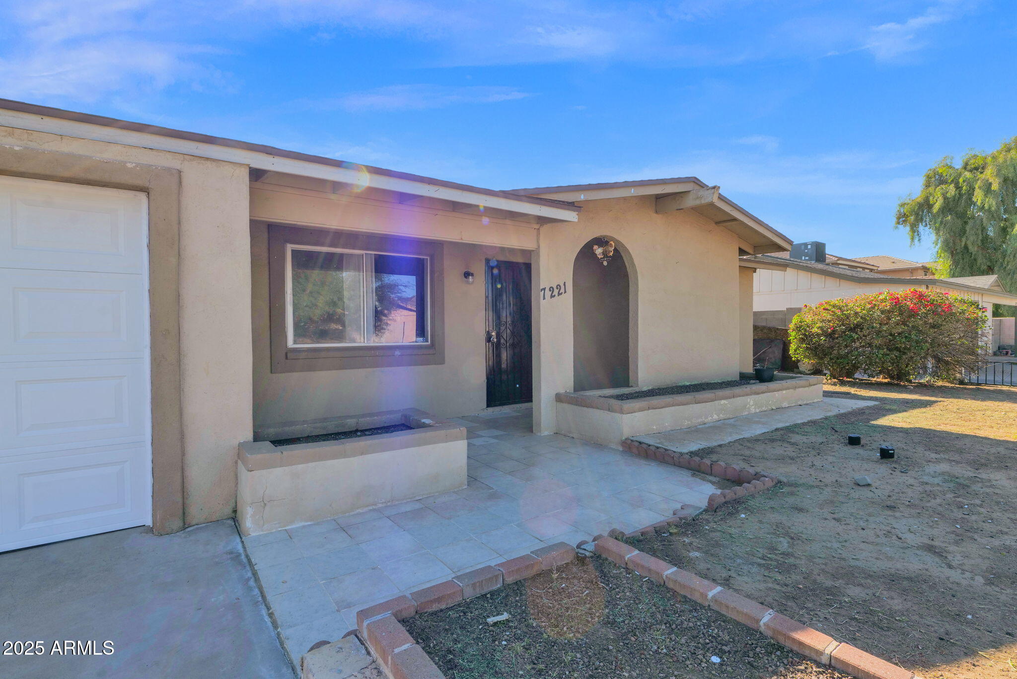 7221 Virginia Avenue Phoenix, AZ 85035 - Photo 4 of 33 a view of a house with a backyard