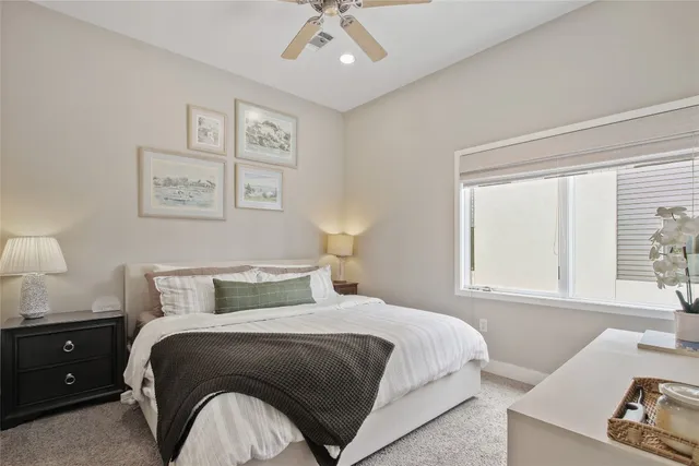 a view of staircase with white walls and a window