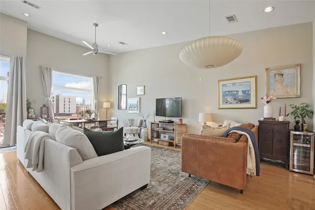 a kitchen with granite countertop appliances and a dining table