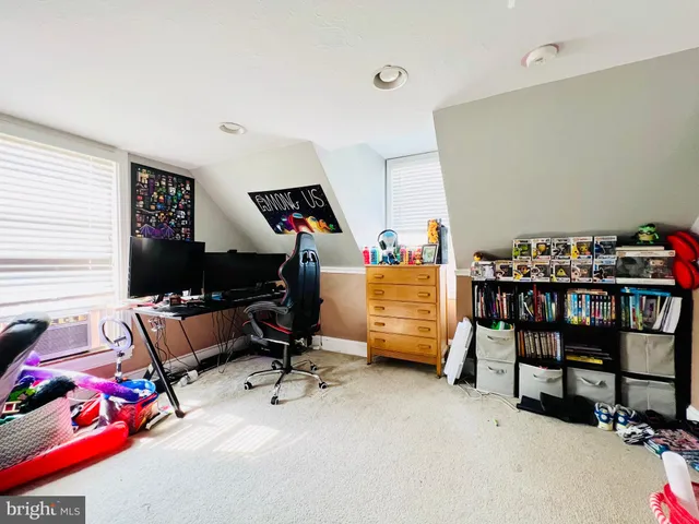 a bedroom with furniture and a window