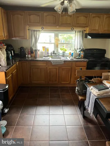 a bedroom with a bed and painting on the wall