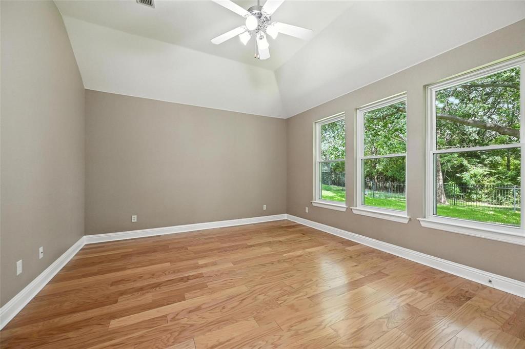 8974 Ranch Bluff Court Benbrook, TX 76126 - Photo 28 of 37 a view of an empty room with wooden floor and a window
