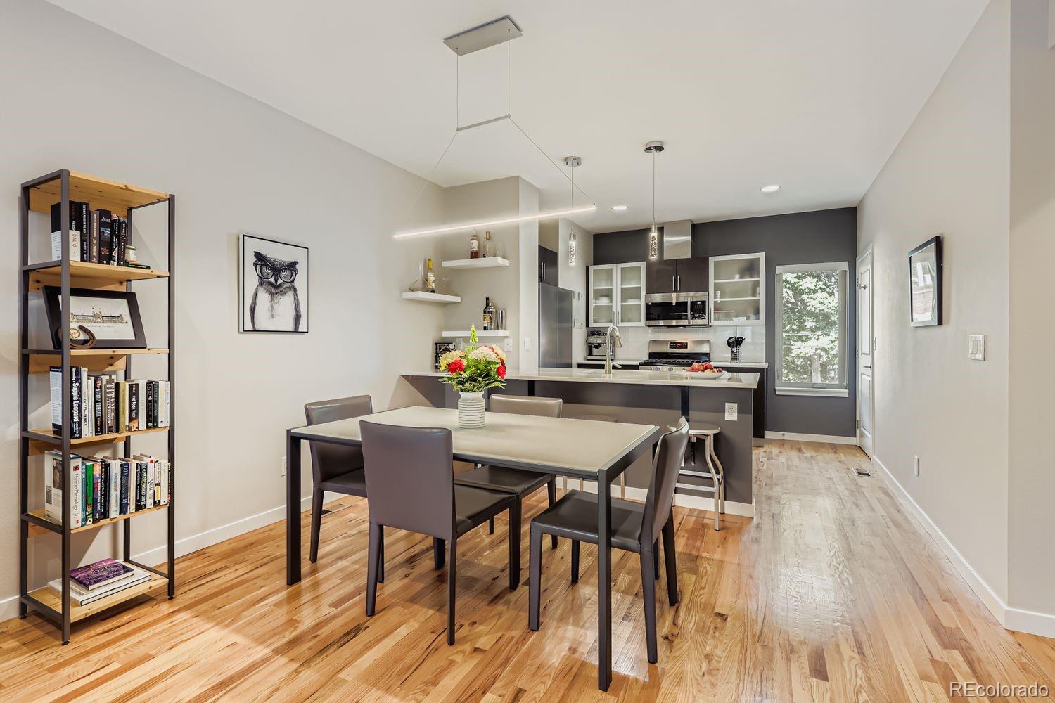 2715 Decatur Street Denver, CO 80211 - Photo 15 of 39 a view of a dining room with furniture and wooden floor