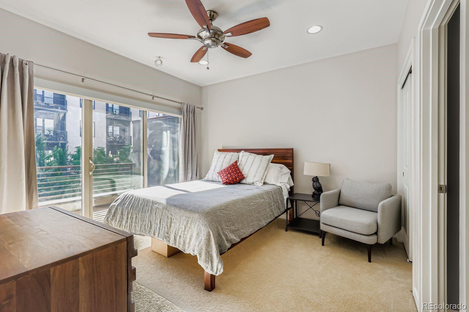 2715 Decatur Street Denver, CO 80211 - Photo 17 of 39 a bedroom with a bed and a couch