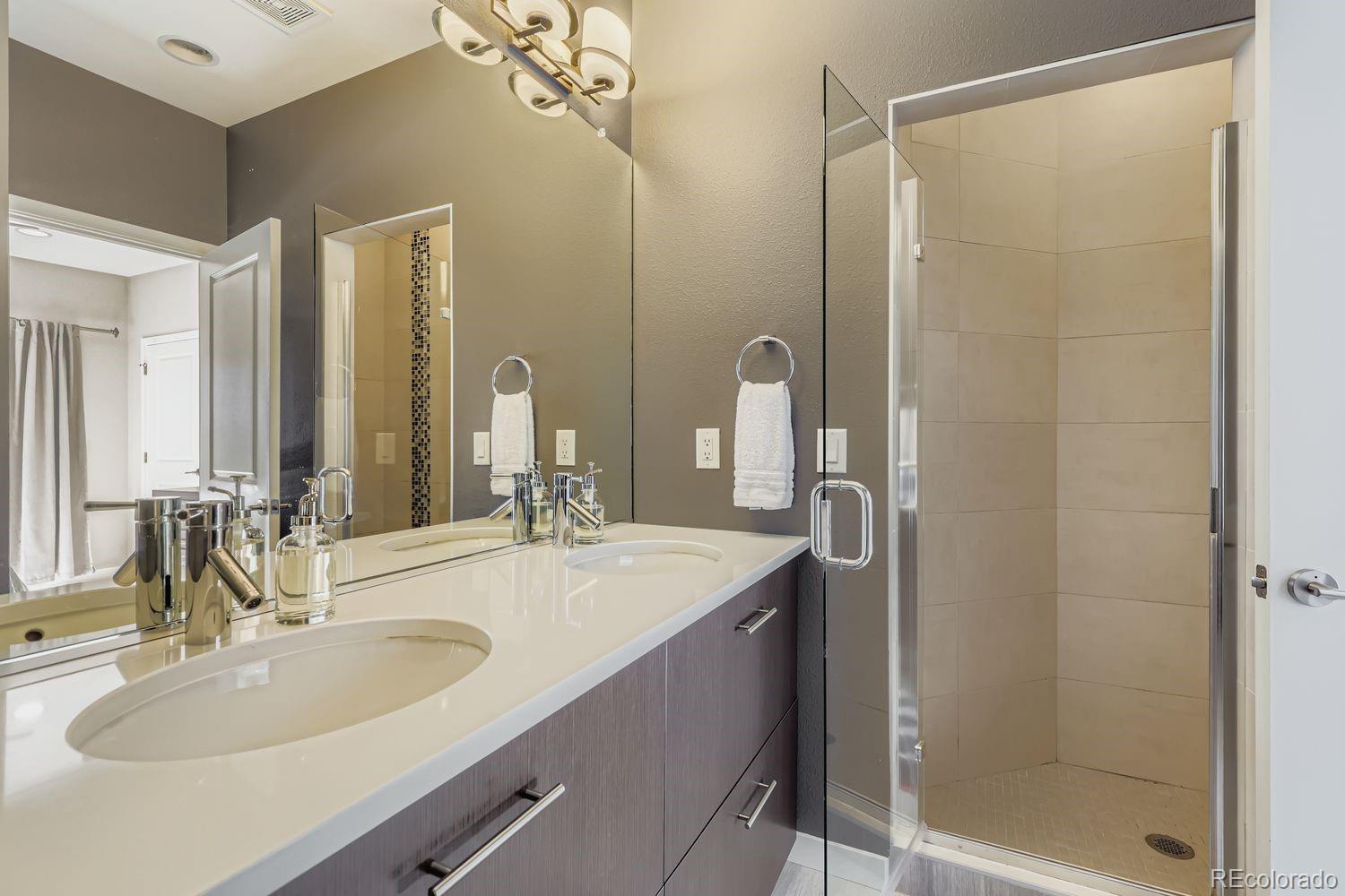 2715 Decatur Street Denver, CO 80211 - Photo 20 of 39 a bathroom with a sink and a mirror