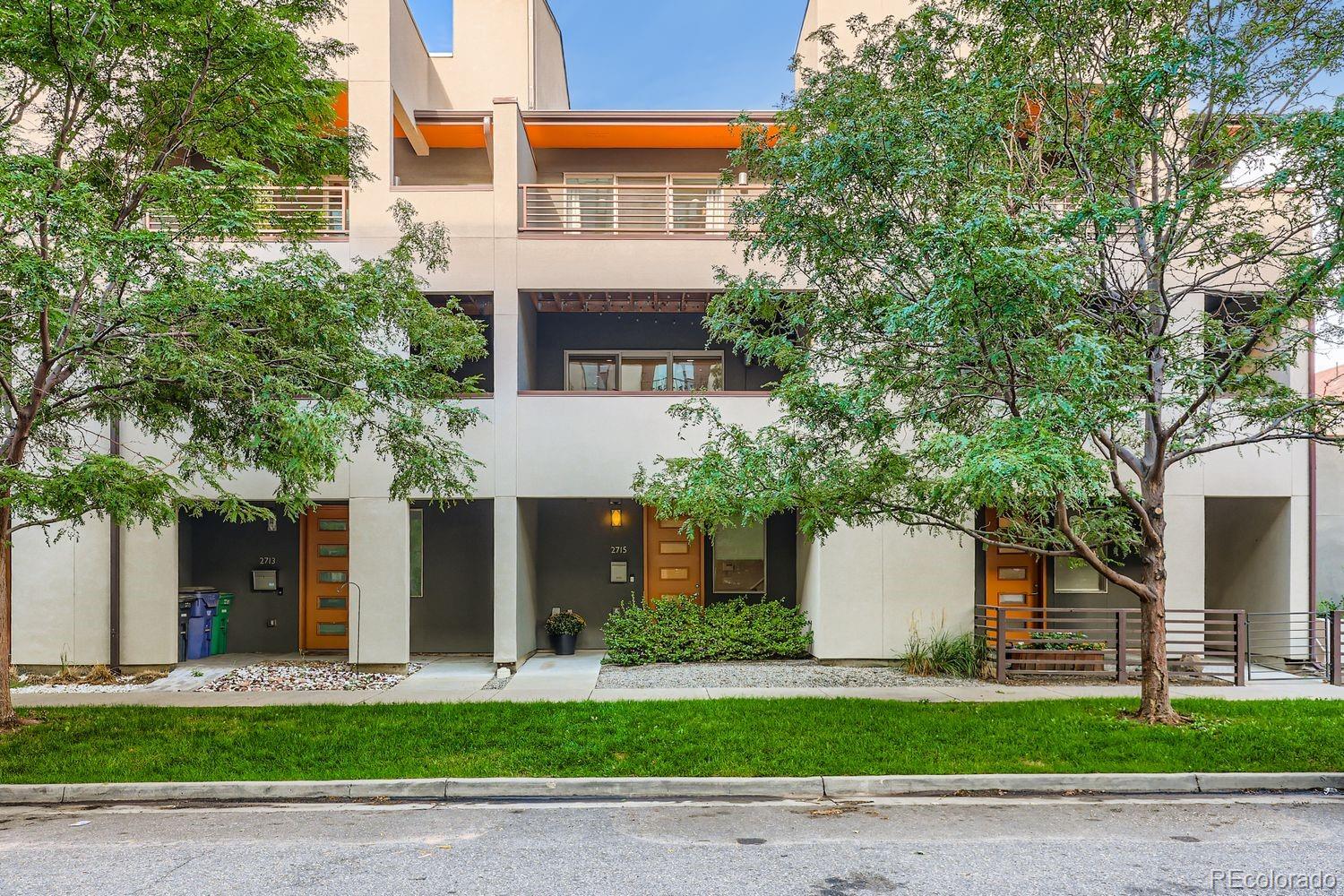 2715 Decatur Street Denver, CO 80211 - Photo 2 of 39 a front view of a house with a yard and garage
