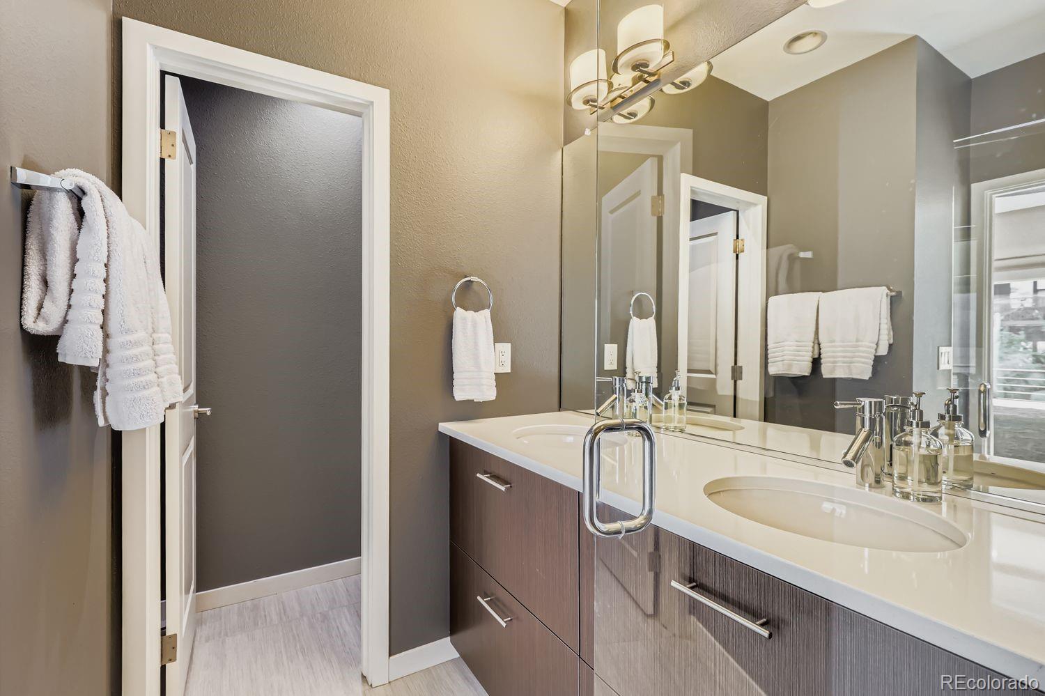 2715 Decatur Street Denver, CO 80211 - Photo 21 of 39 a bathroom with a sink vanity and shower