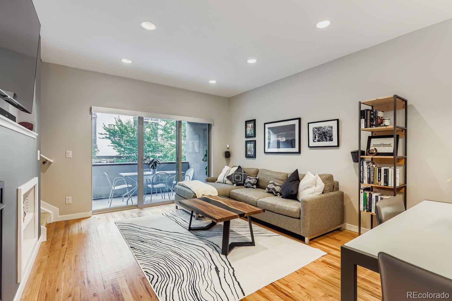 2715 Decatur Street Denver, CO 80211 - Photo 6 of 39 a living room with furniture and a wooden floor