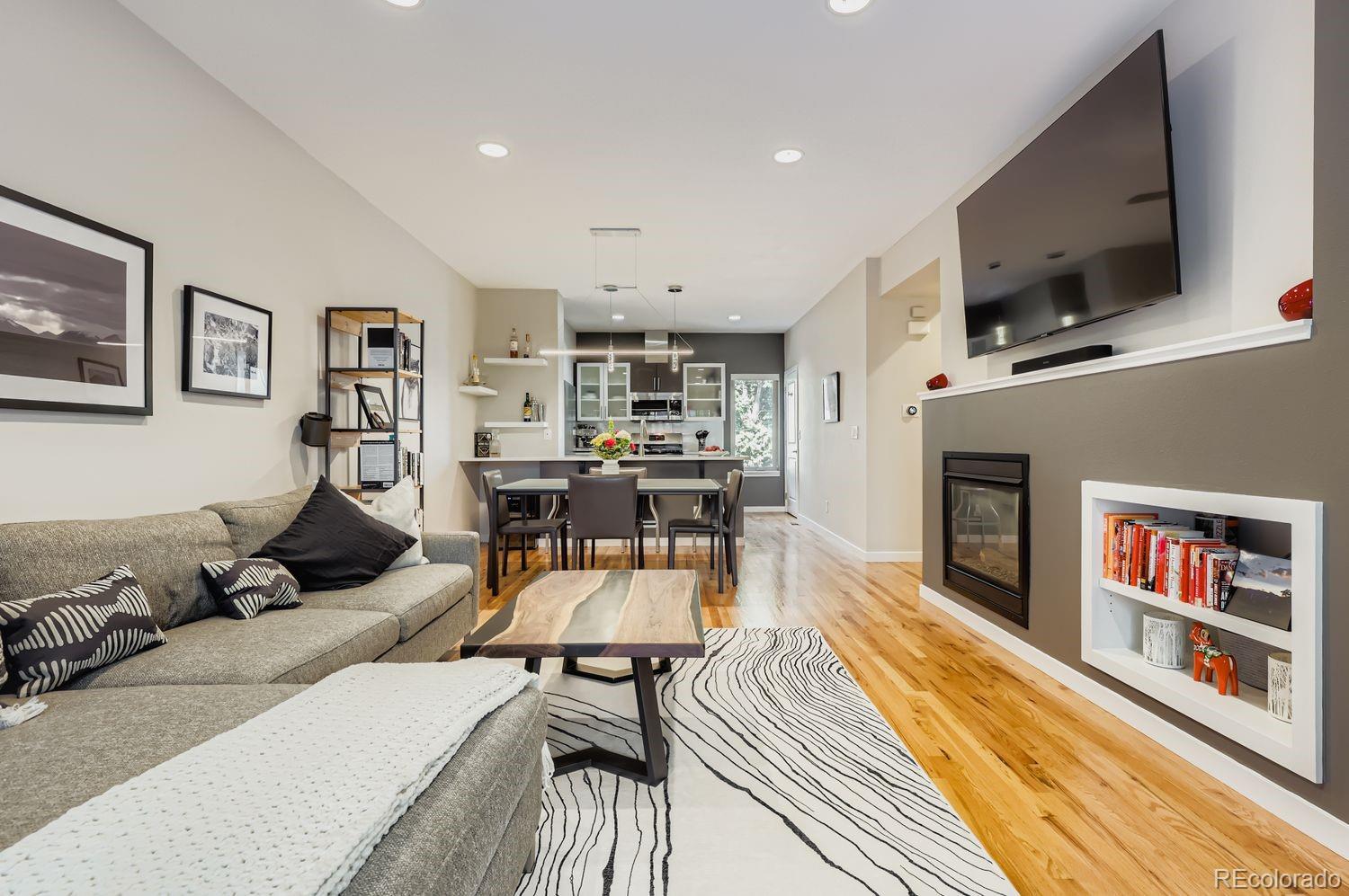 2715 Decatur Street Denver, CO 80211 - Photo 8 of 39 a living room with furniture and a flat screen tv