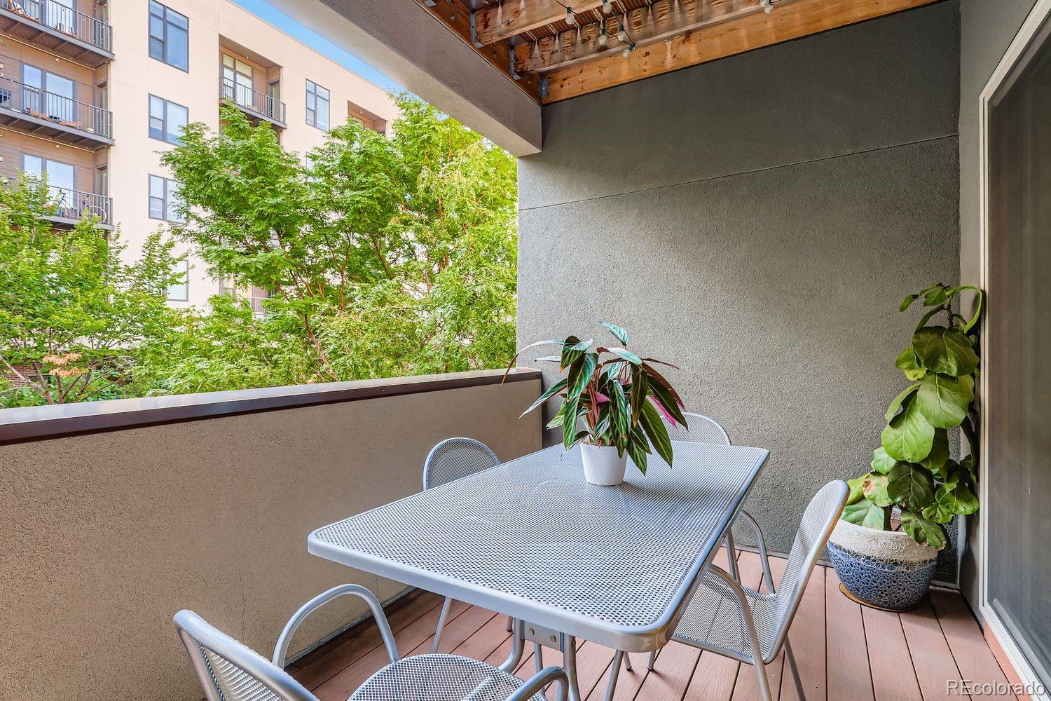 2715 Decatur Street Denver, CO 80211 - Photo 9 of 39 a view of a balcony with table and chairs