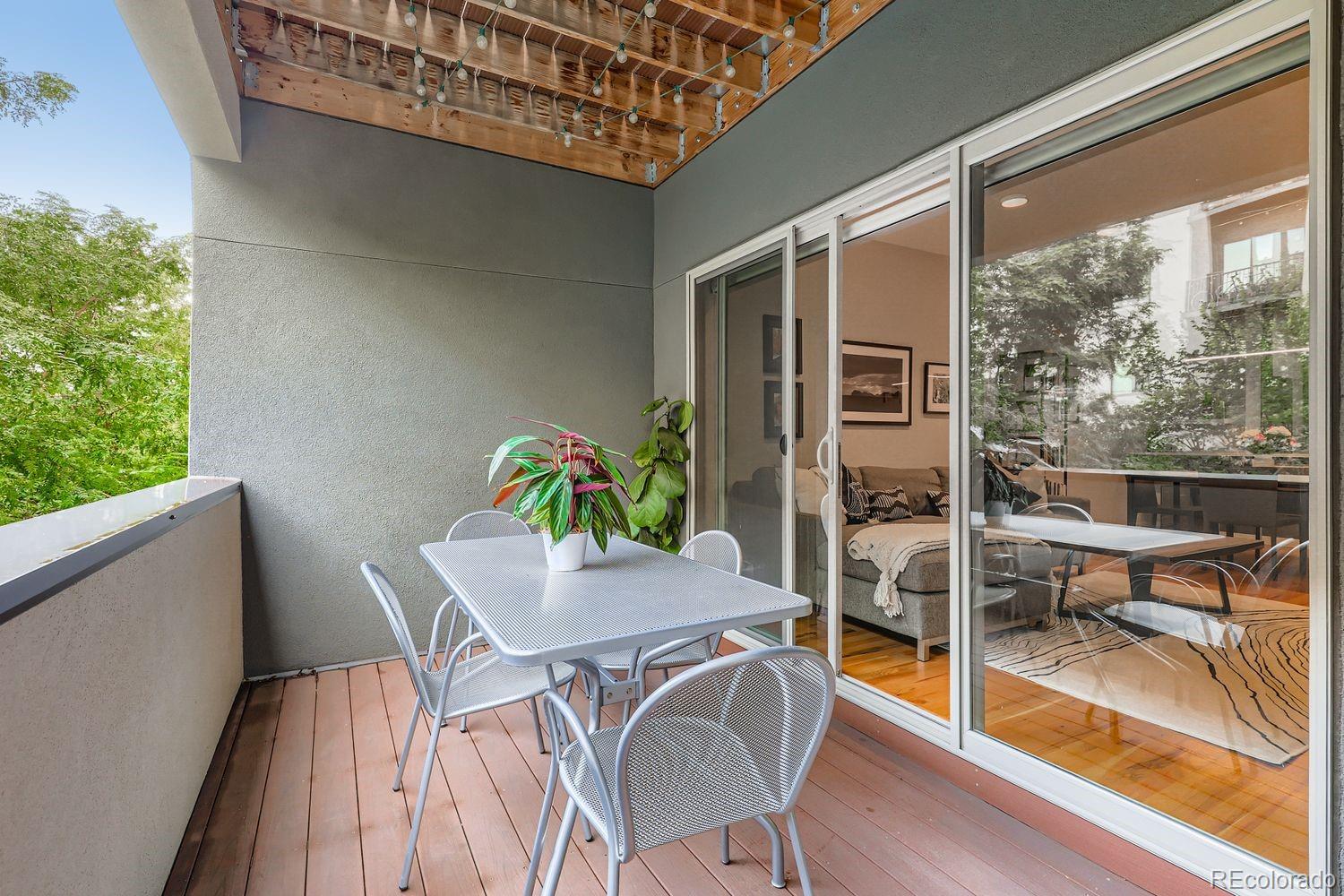 2715 Decatur Street Denver, CO 80211 - Photo 10 of 39 a view of a dining room with furniture window and wooden floor