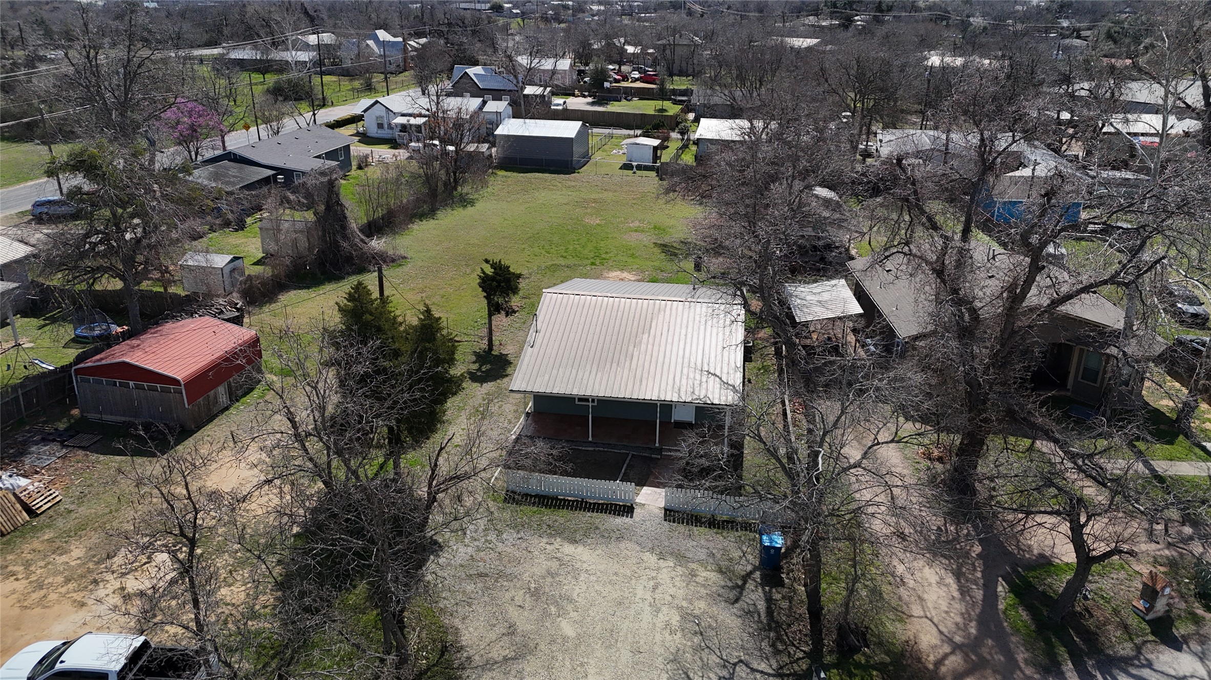207 Harris Street Elgin, TX 78621 - Photo 18 of 19 a view of a house with pool and chairs