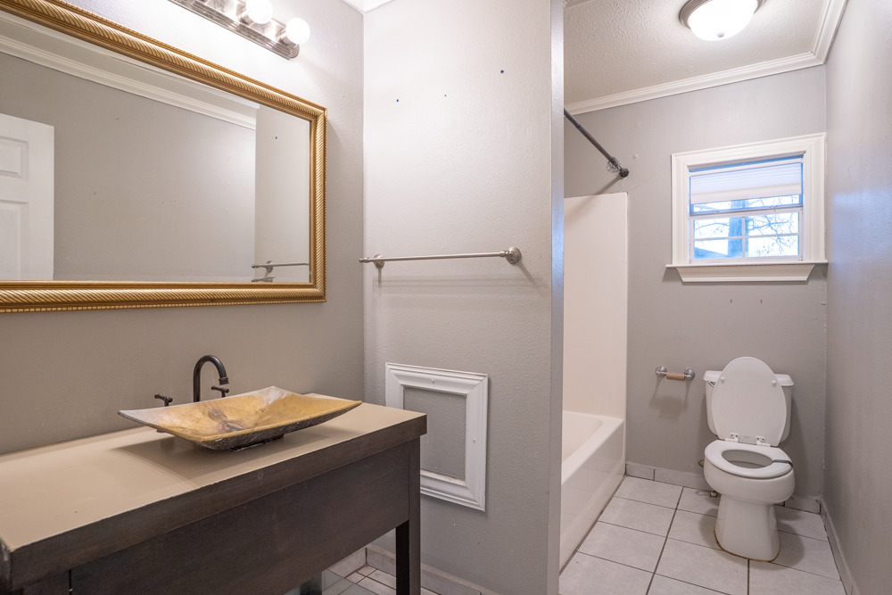 207 Harris Street Elgin, TX 78621 - Photo 8 of 19 a bathroom with a sink and a toilet