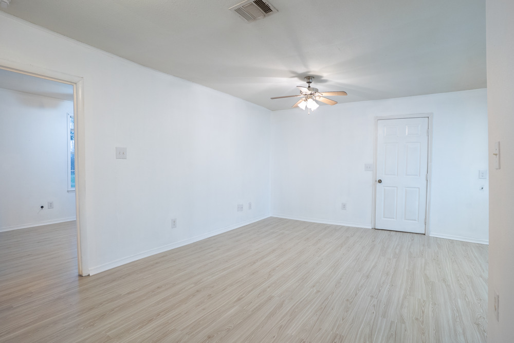 207 Harris Street Elgin, TX 78621 - Photo 9 of 19 wooden floor in an empty room