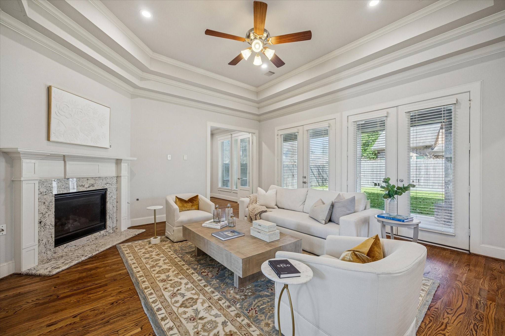1802 Wakefield Drive Houston, TX 77018 - Photo 15 of 47 Charming fireplace creates a warm focal point, while elegant French doors open seamlessly to the backyard blending cozy indoor living with inviting outdoor space.