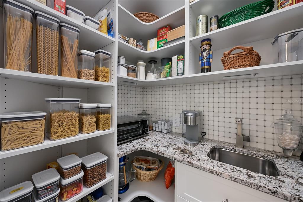 700 Regatta Way Bradenton, FL 34208 - Photo 22 of 78 a kitchen that has a sink and a stove