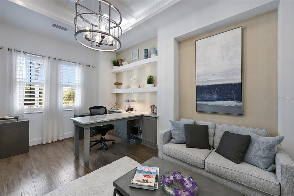 700 Regatta Way Bradenton, FL 34208 - Photo 35 of 78 a living room with furniture a table and a window