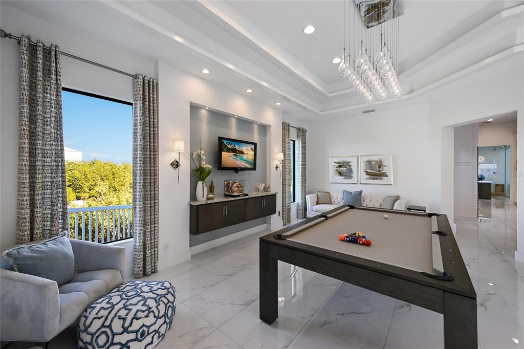 700 Regatta Way Bradenton, FL 34208 - Photo 39 of 78 a living room with furniture and a flat screen tv