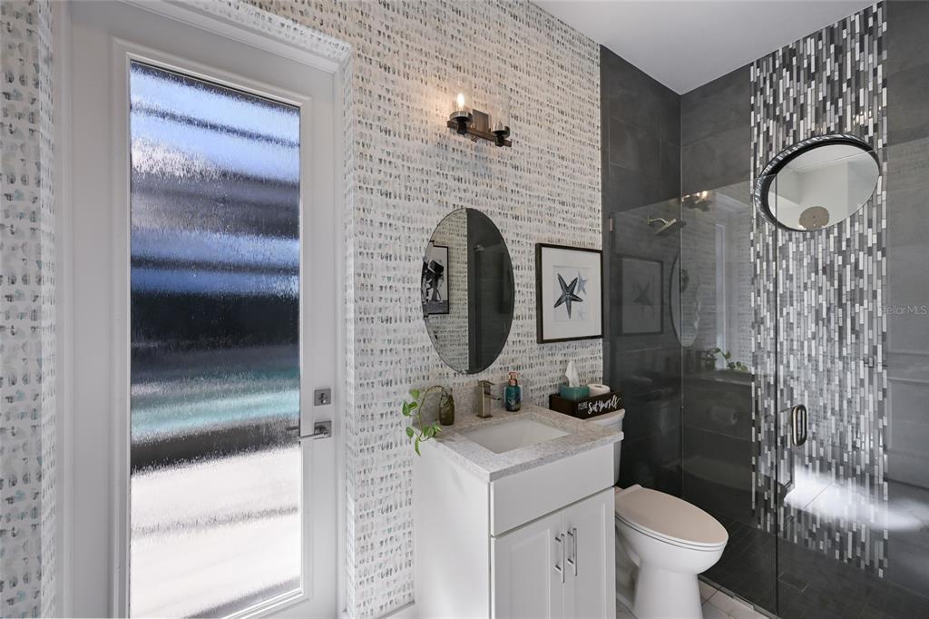 700 Regatta Way Bradenton, FL 34208 - Photo 41 of 78 a bathroom with a toilet a sink and shower