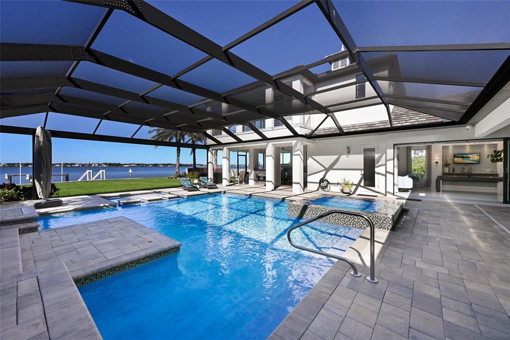 700 Regatta Way Bradenton, FL 34208 - Photo 58 of 78 a view of a swimming pool with a patio