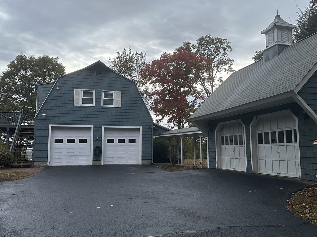 54 Old Gilbertville Road Ware, MA 01082 - Photo 2 of 19 a view of a large white house with a large windows