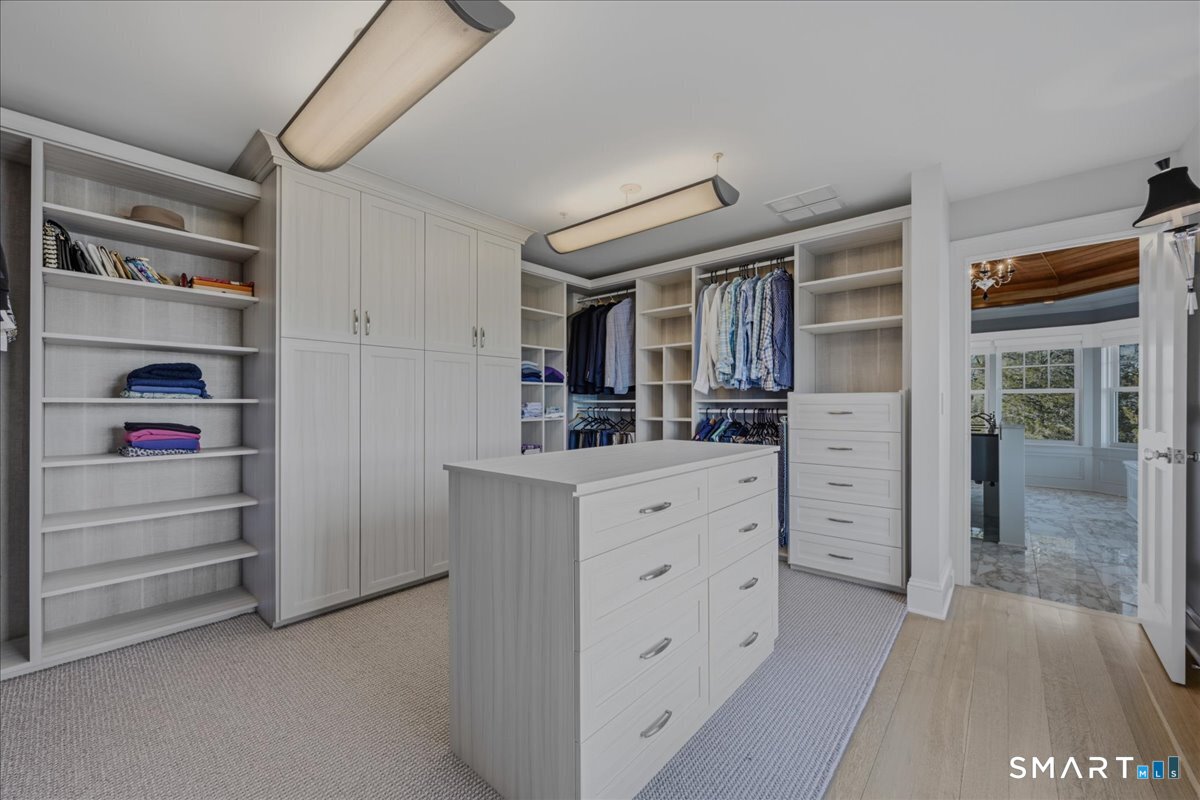 175 River Road Essex, CT 06426 - Photo 22 of 40 Dressing room and walk in closet in the primary bedroom suite