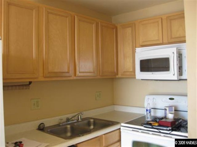 567 West 4th Street, Unit 905 Reno, NV 89503 - Photo 5 of 8 a kitchen with a sink and cabinets