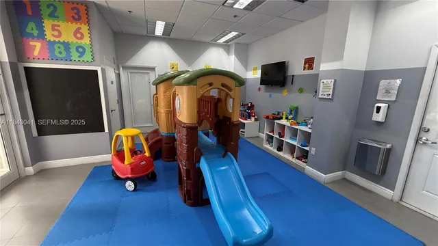 a view of a swimming pool with outdoor seating