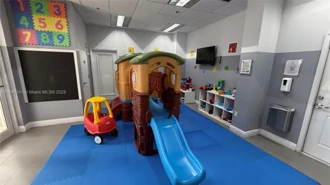 a view of a swimming pool with outdoor seating