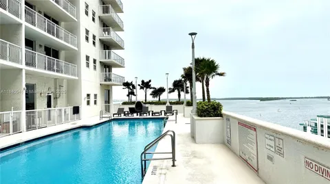 a view of a swimming pool with a lounge chair