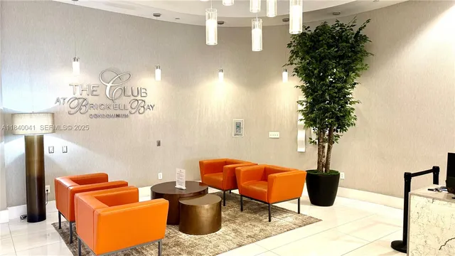 a living room with lots of furniture and gym equipment