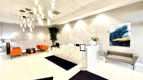 a hallway with sliding door and a glass door