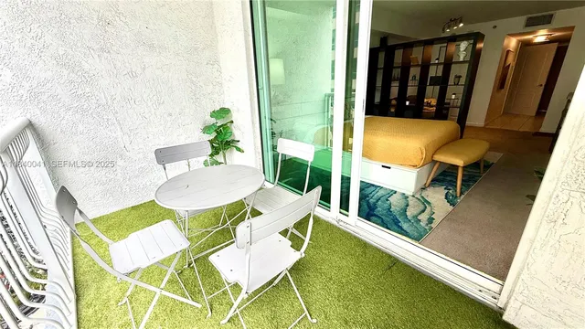 a view of a balcony with chairs