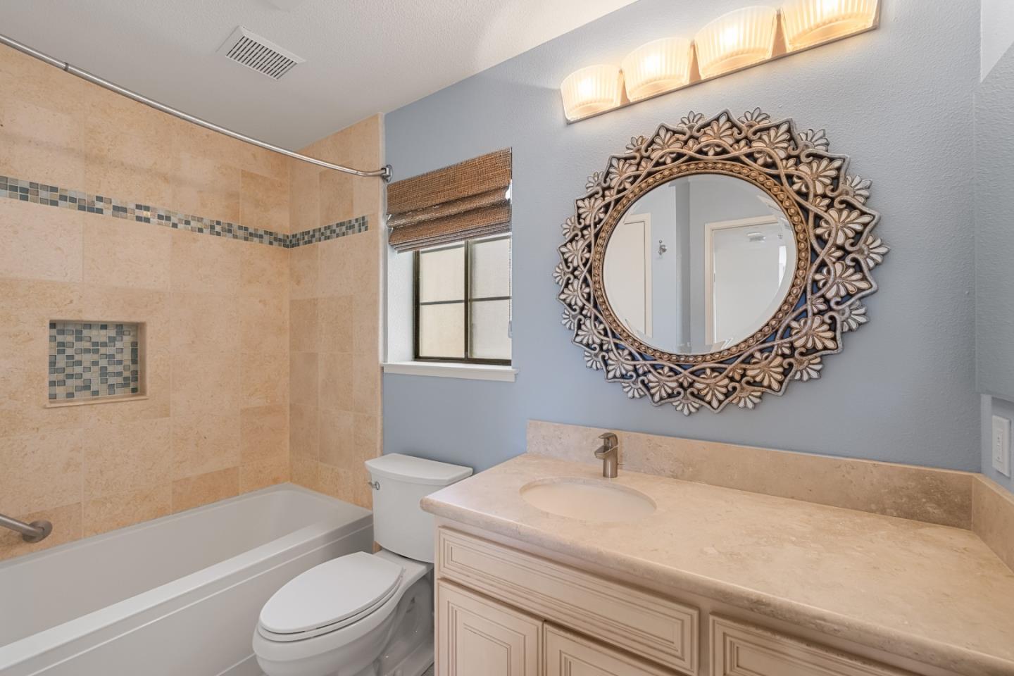 121 Quail Run Court Del Rey Oaks, CA 93940 - Photo 21 of 33 a bathroom with a sink a toilet and a mirror