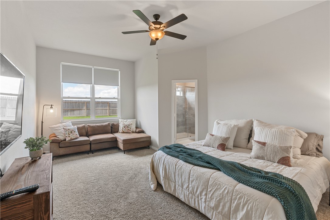 4746 Holm Oak Road College Station, TX 77845 - Photo 20 of 25 a bedroom with a balcony a bed and a large window