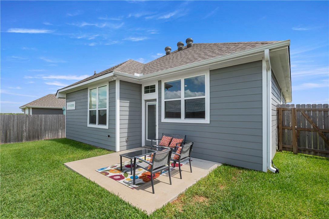 4746 Holm Oak Road College Station, TX 77845 - Photo 23 of 25 a view of a backyard with table and chairs with wooden fence