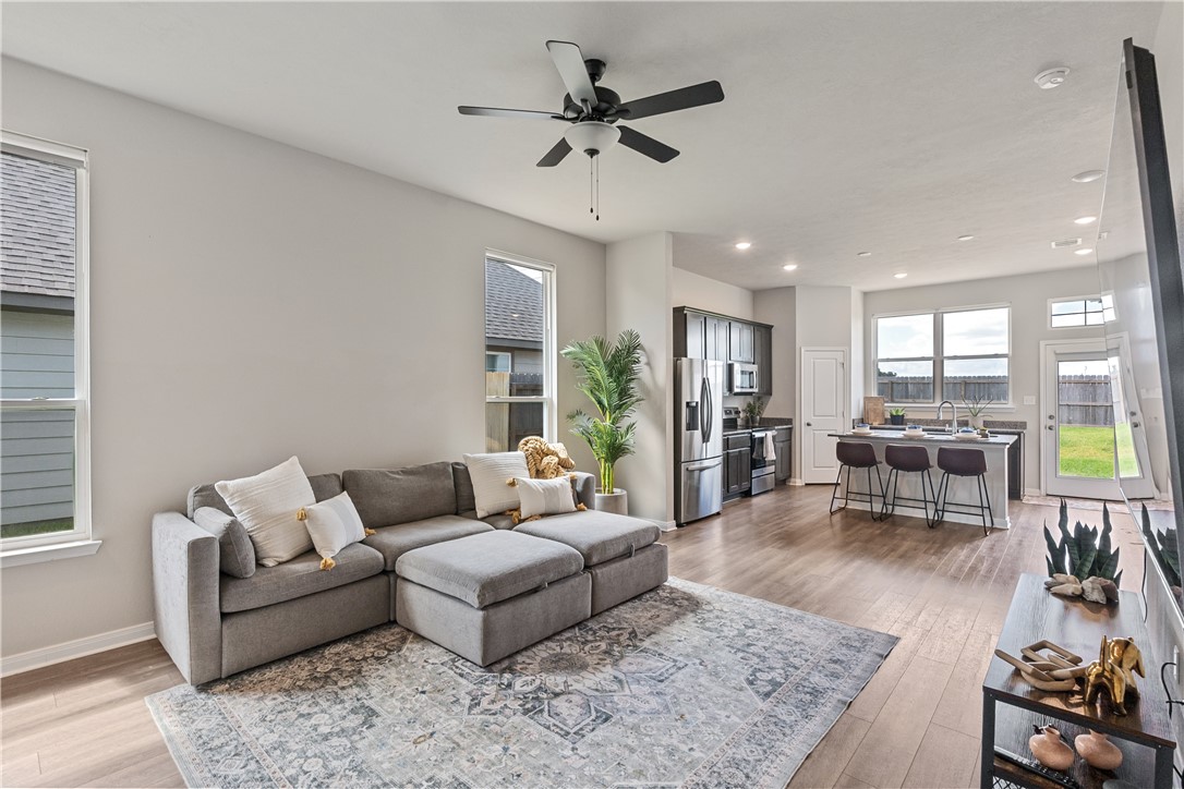 4746 Holm Oak Road College Station, TX 77845 - Photo 6 of 25 a living room with furniture and wooden floor
