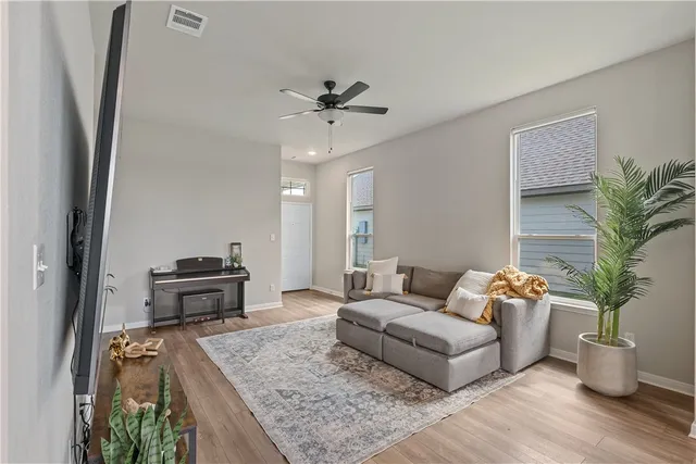 a living room with furniture and a table