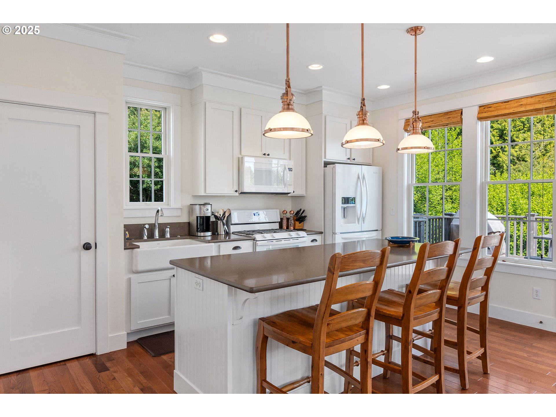 81 Compass Street Pacific Beach, WA 98571 - Photo 11 of 47 a kitchen with a dining table chairs sink and cabinets