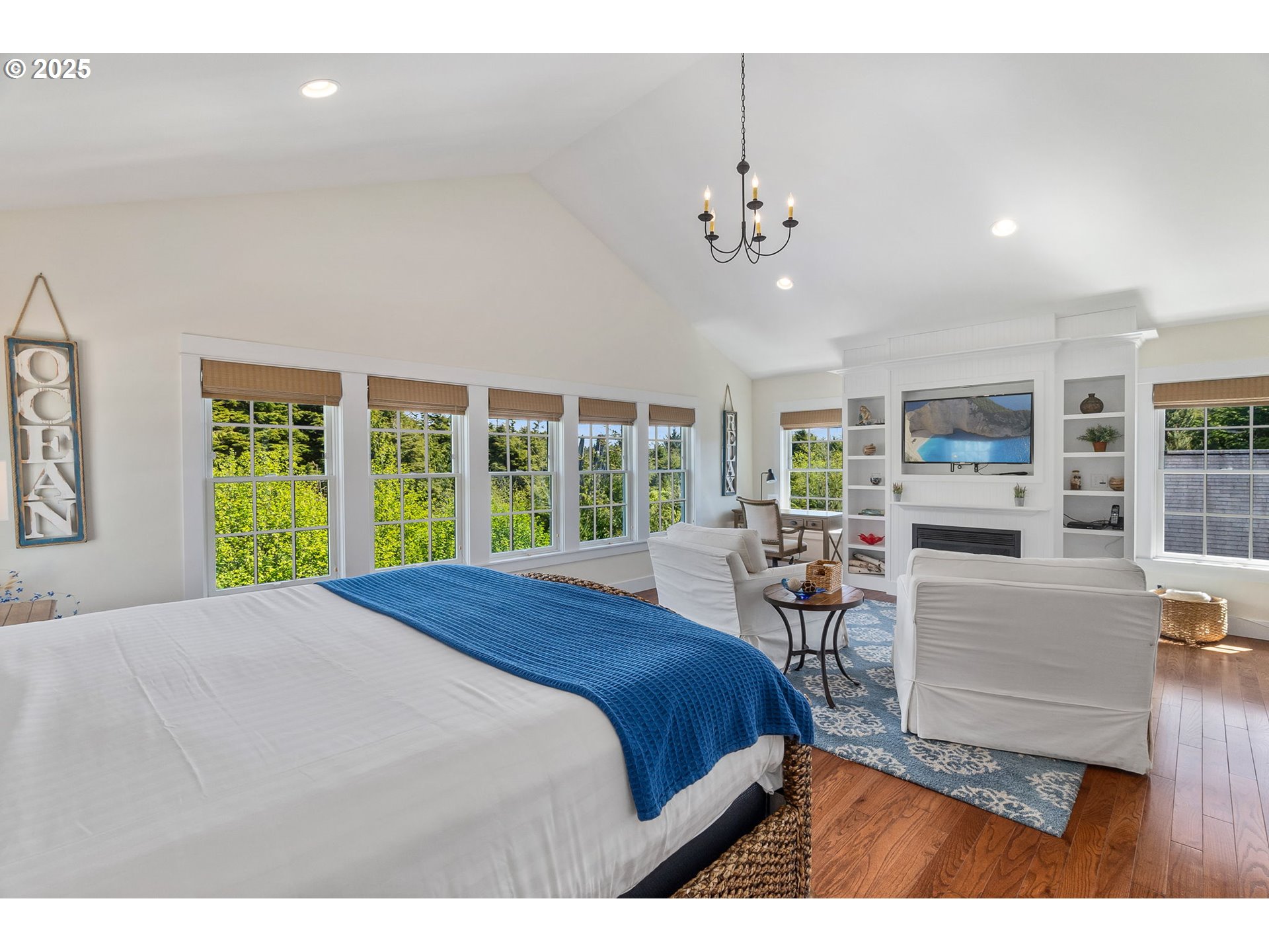 81 Compass Street Pacific Beach, WA 98571 - Photo 18 of 47 a bedroom with a large bed and a large window