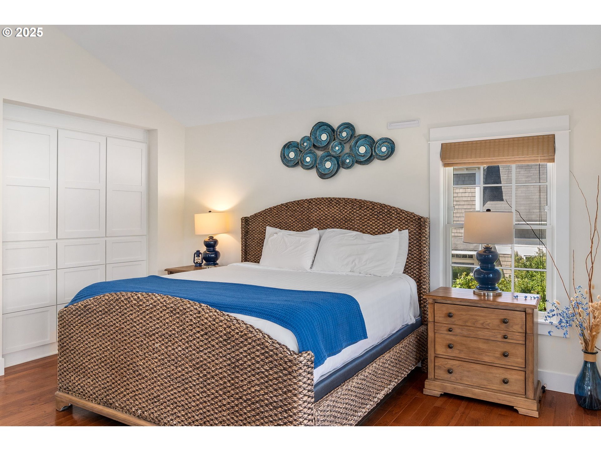 81 Compass Street Pacific Beach, WA 98571 - Photo 19 of 47 a bedroom with a bed and a potted plant