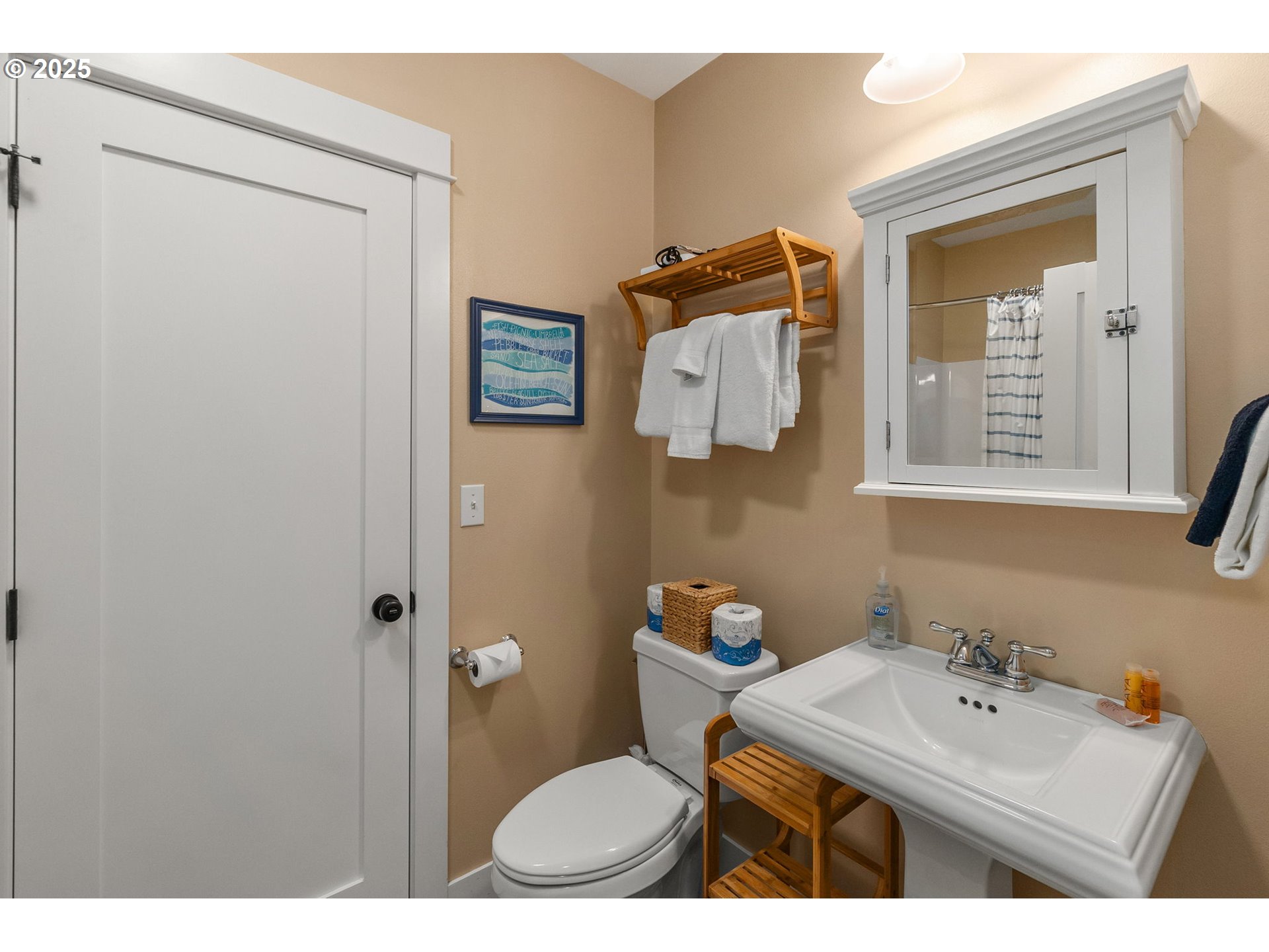 81 Compass Street Pacific Beach, WA 98571 - Photo 27 of 47 a bathroom with a sink mirror and toilet