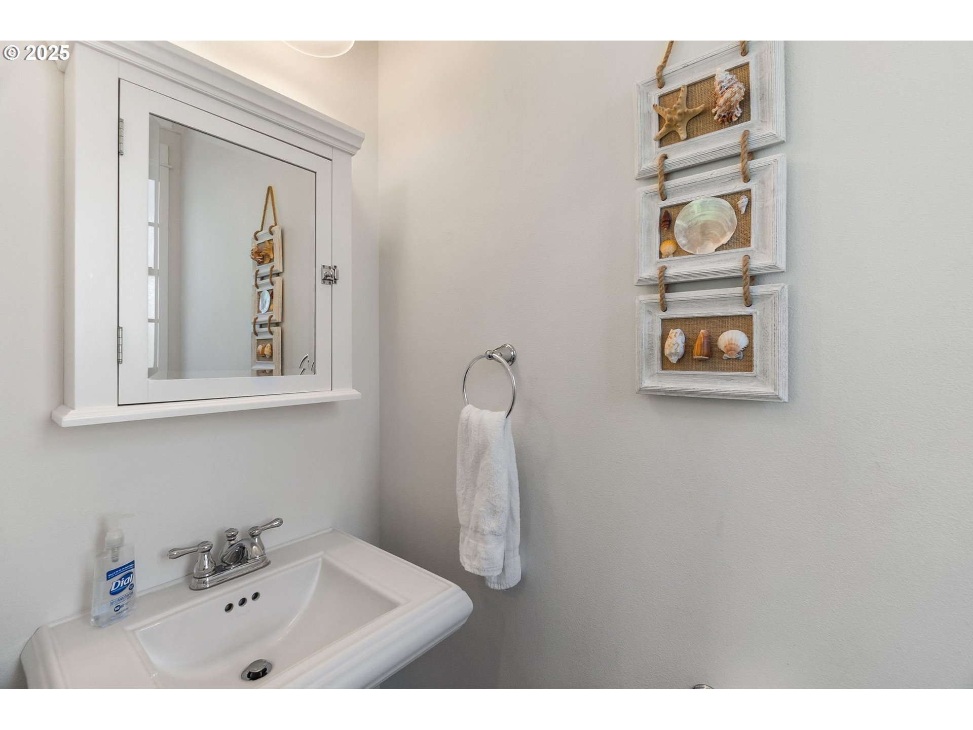 81 Compass Street Pacific Beach, WA 98571 - Photo 28 of 47 a bathroom with a toilet a sink and mirror