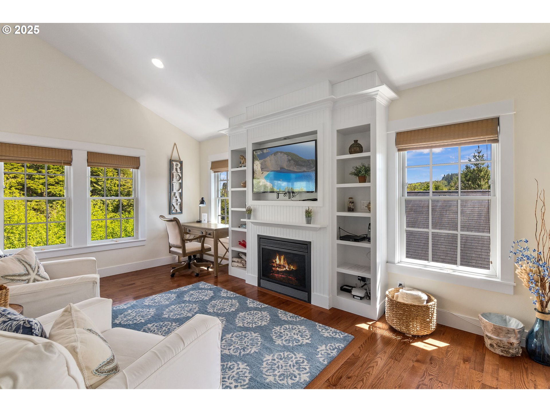 81 Compass Street Pacific Beach, WA 98571 - Photo 5 of 47 a living room with furniture and a fireplace