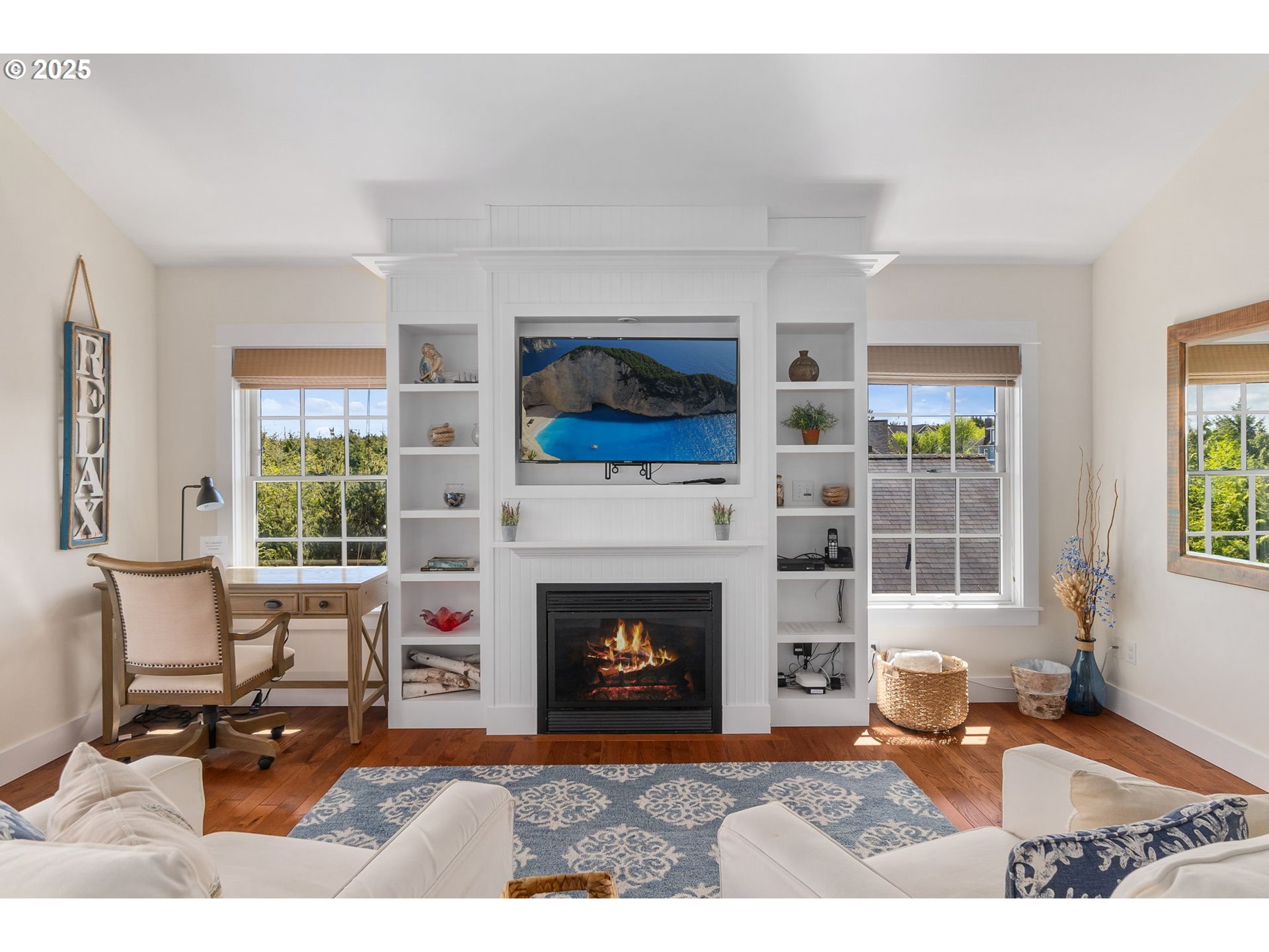 81 Compass Street Pacific Beach, WA 98571 - Photo 6 of 47 a living room with furniture a window and a fireplace