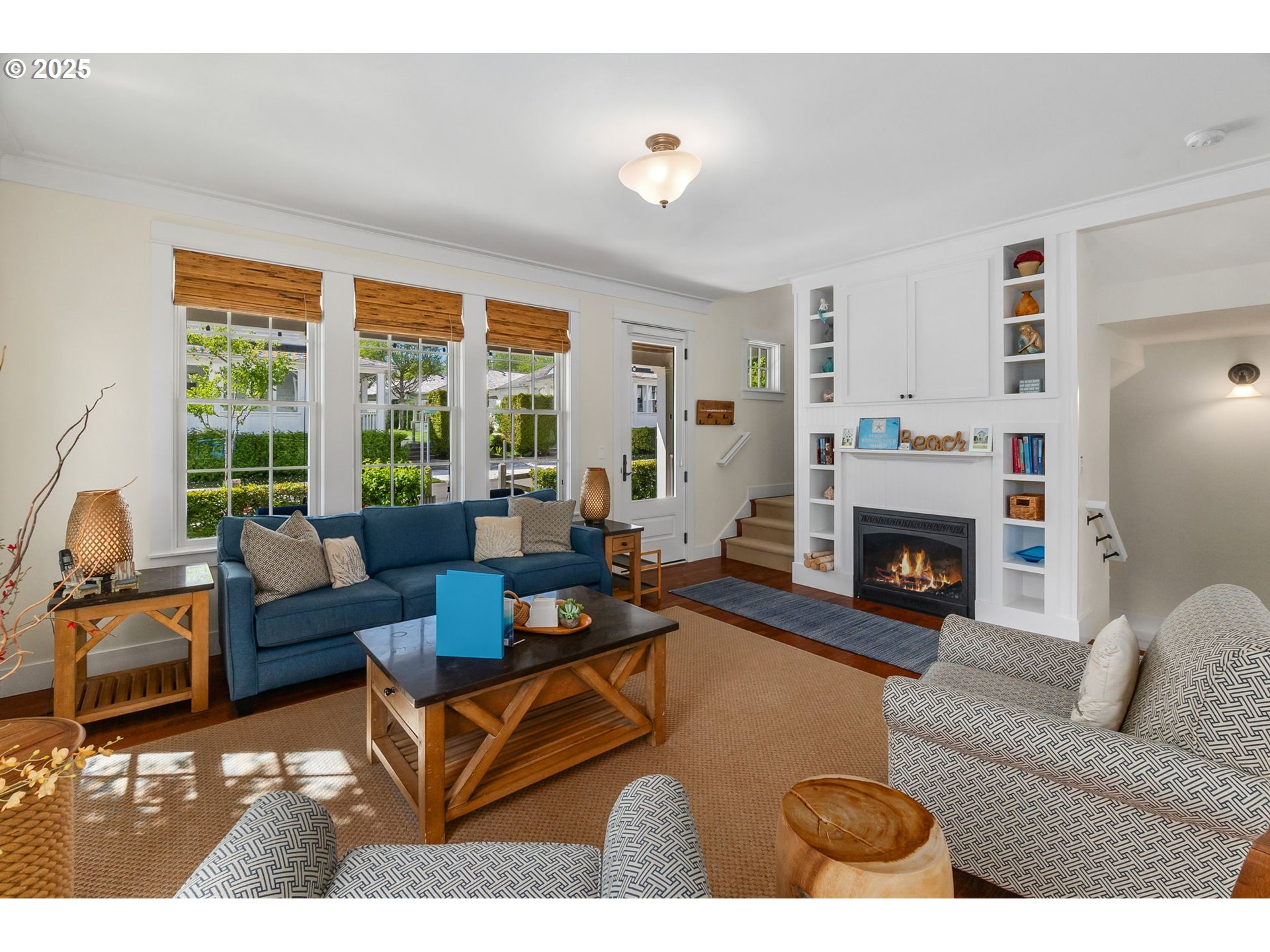 81 Compass Street Pacific Beach, WA 98571 - Photo 8 of 47 a living room with furniture large window and a fireplace