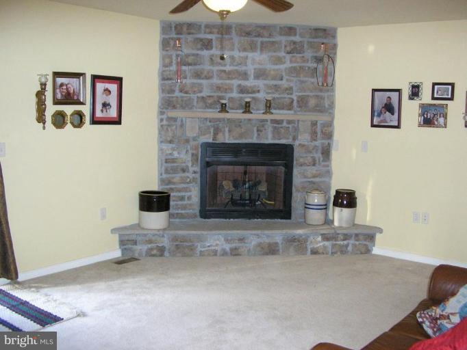 7501 Scotts Farm Road Spotsylvania, VA 22553 - Photo 18 of 23 Family room w/stone gas fireplace & door to deck