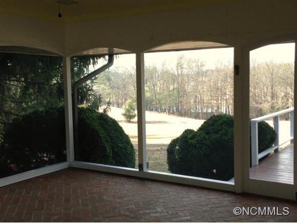533 Hooper Creek Road Tryon, NC 28782 - Photo 14 of 16 a view of backyard with window and wooden floor