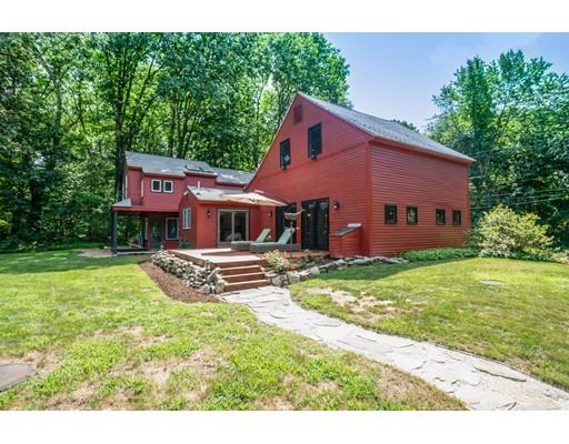 1001 Depot Road Boxborough, MA 01719 - Photo 27 of 34 a front view of a house with a garden and yard